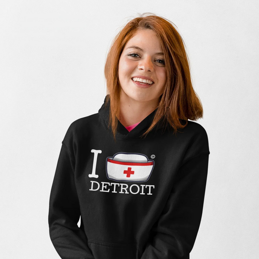 Nurse wearing the I Nurse Detroit black hoodie